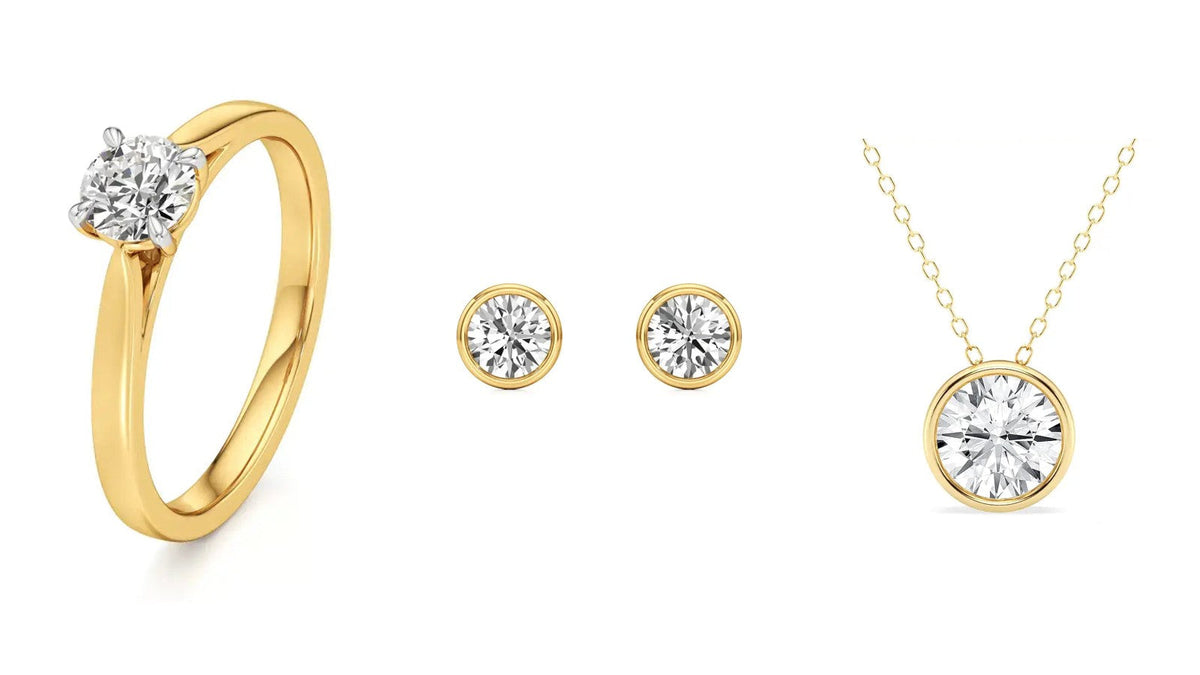 Three Nivara lab grown diamond pieces in yellow gold, each made in 14K and 18K: a solitaire ring, bezel stud earrings and a bezel pendant